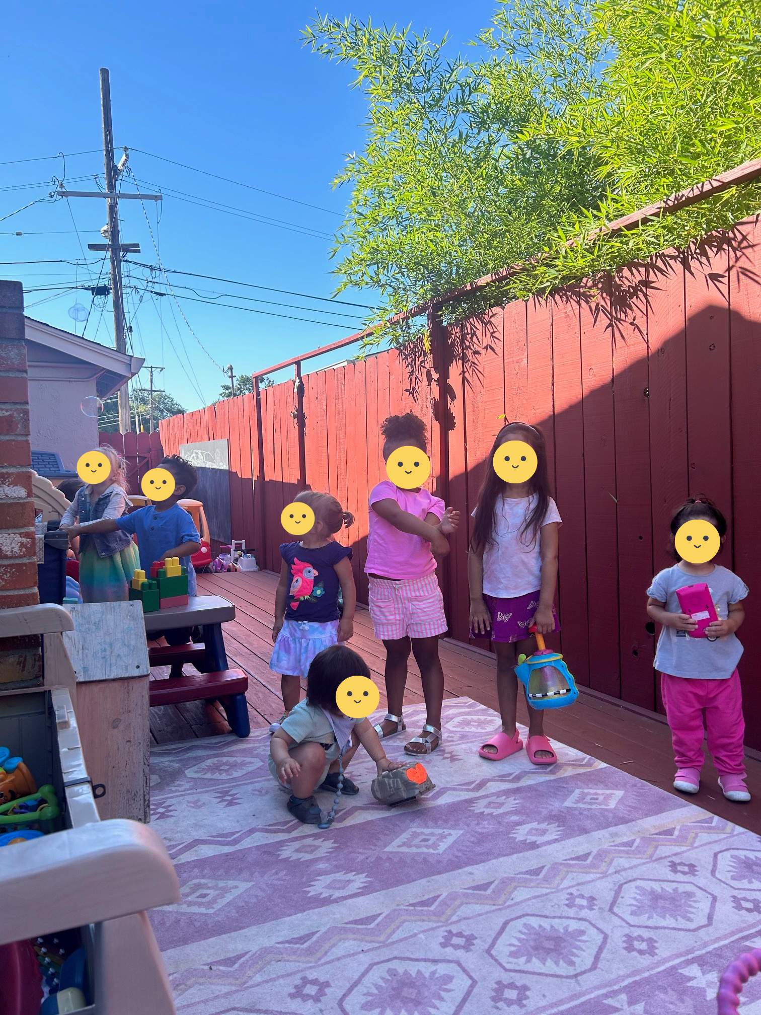 Children doing parallel play outsite on a sunny day.